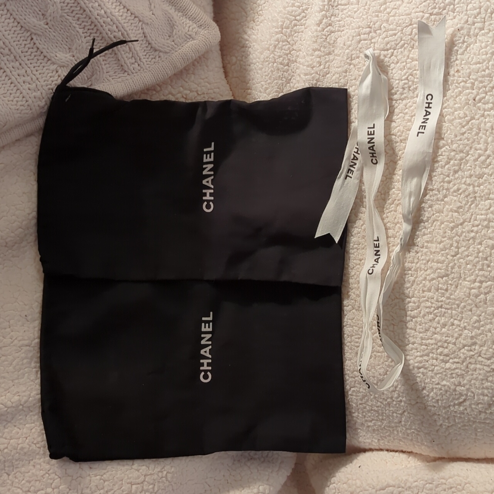 2 Chanel dust bags and ribbon